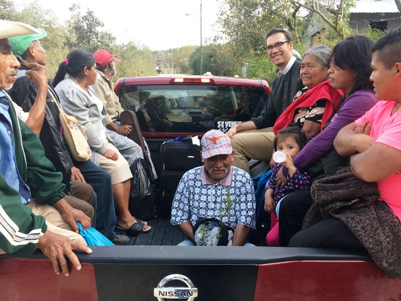 Transportation to the celebration of a new bishop means riding Pame-style in the back of a pickup truck.